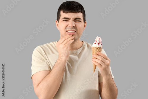 Young man with ice cream su...