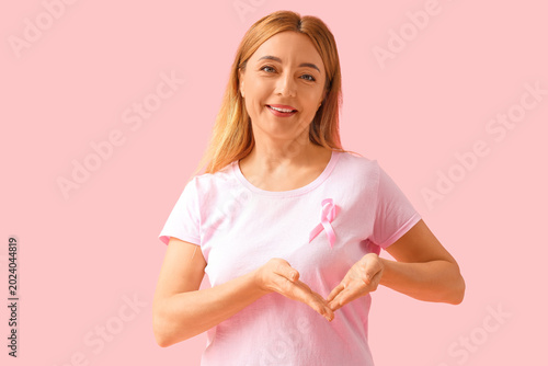 Mature woman with pink ribb...