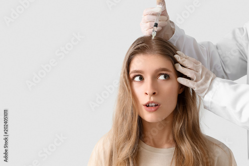Surprised young woman with ...