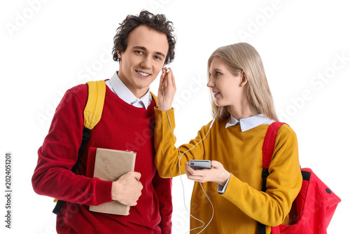 Teenage couple with earphon...
