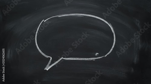 White Chalk Speech Bubble Drawn On A Textured Dark Black Chalkboard Surface With Simple Minimalist Design