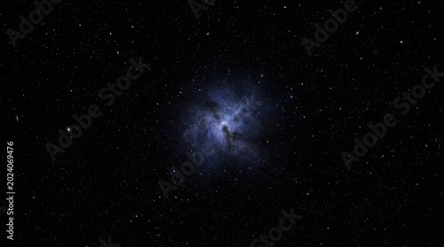 Deep space vista featuring a glowing blue nebula surrounded by a dense field of distant white stars against a pitch black void of the infinite universe