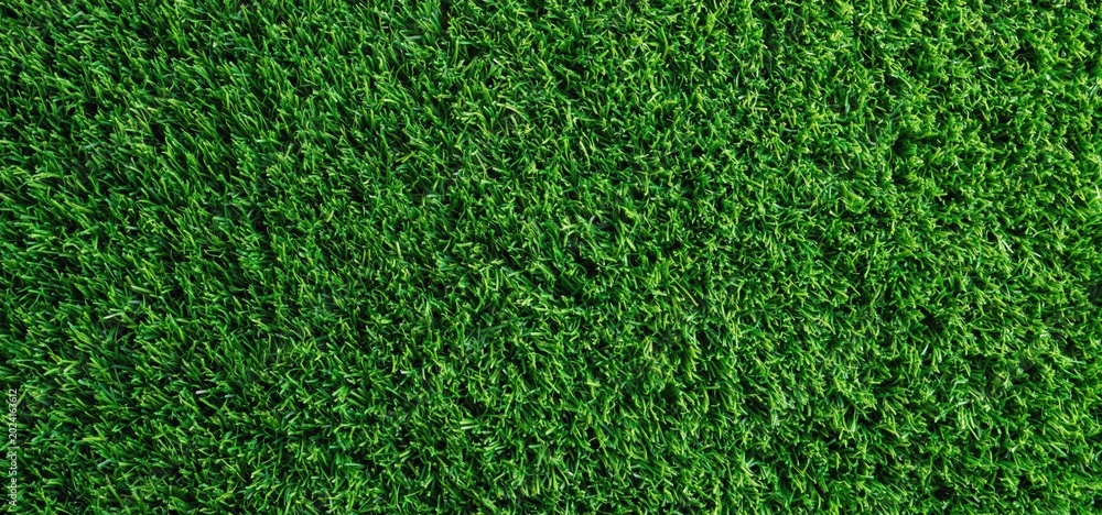 Obraz premium Green artificial turf texture providing vibrant background