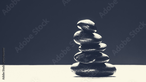 Billede på lærred Minimalist monochrome stack of zen stones with vintage sepia toning and copy spa