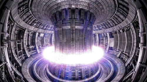 Symmetrical interior of tokamak nuclear fusion reactor with brilliant plasma ring, futuristic clean energy research