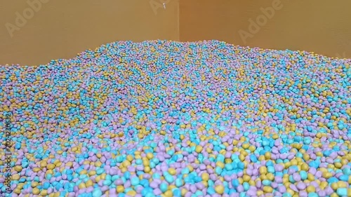 Ball pit installation in new yorks factory for vibrant, creative projects and art inspiration, suitable for presentations and design concepts.