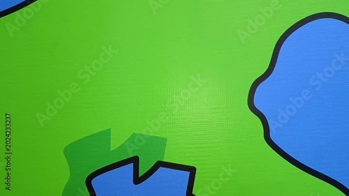 Abstract geometric world map design in green and blue hues. Perfect for educational materials, travel brochures, and global business presentations.