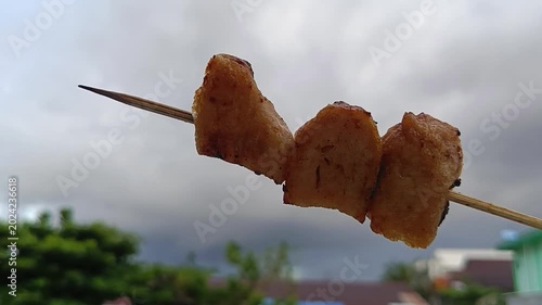 Grilled skewered banana snack popular in the philippines. Suitable for food blog posts, travel articles, and culinary magazines.