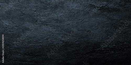 Tableau sur toile Dark textured slate background with rough stone surface and subtle blue underton