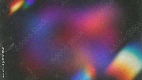 Fotografía Abstract colorful light leaks with dark grain texture overlay