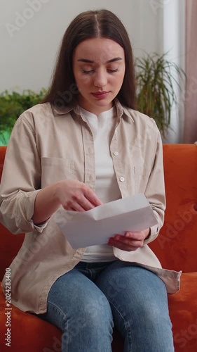 Happy woman open envelope letter, reading it. Career growth advance promotion, bank loan approve, successful admission to university monetary award long-awaited invitation great news, lottery game win