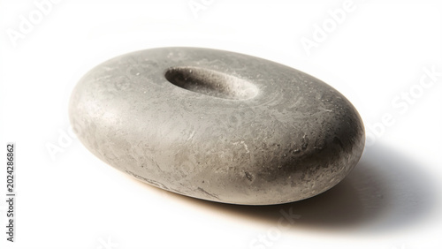 Minimalist worry stone styled for calm wellness aesthetic on pure white