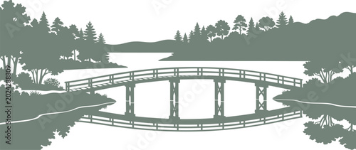 Symmetrical bridge silhouette reflected in still water with a forest horizon