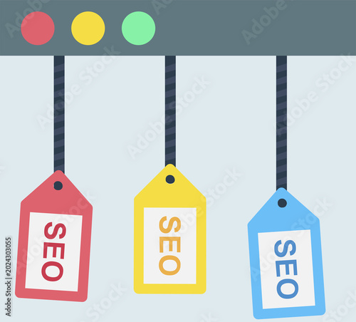 Hanging tags displaying SEO text represent search engine optimization, digital strategy, website ranking, online visibility.