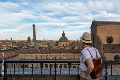Photos Beautiful happy traveler girl looking and  enjoying visiting the historic city of Bologna, Italy