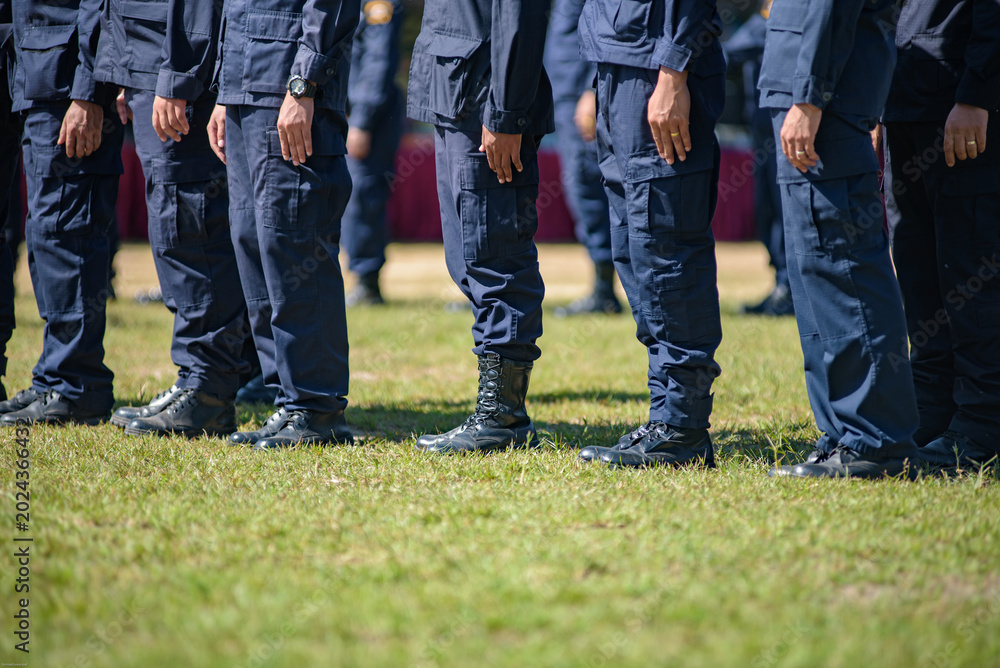 Fototapeta premium Riot police control the crowd practice and review on the grass field.