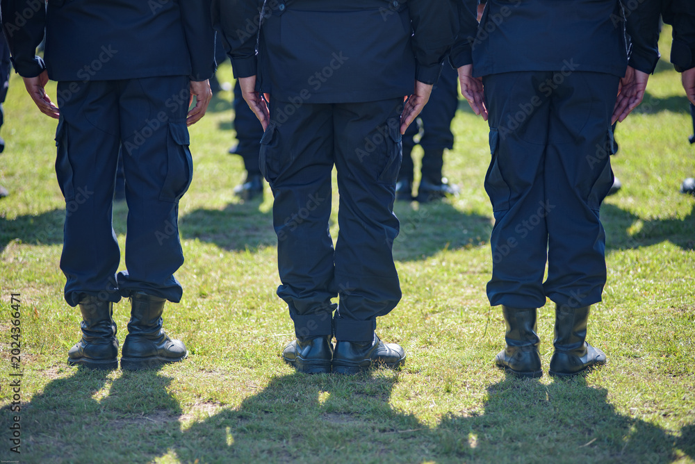 Fototapeta premium Riot police control the crowd practice and review on the grass field.