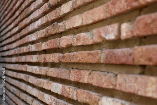 Quadro su tela Ribbed Brick Wall Texture: Linear Pattern of Red Bricks