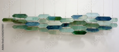 Abstract Glass Art Installation with Layered Mirrored Planes and Prism Effects