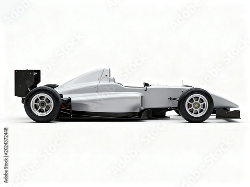 Sleek silver formula racing car parked in a minimalist white studio, side view profile shot.