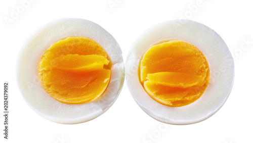 Εκτύπωση καμβά Two halves of a hard-boiled egg showing white albumen and yellow yolk, isolated