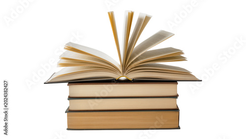 Konstfotografi Stack of old books with one open book showing pages, isolated on transparent bac