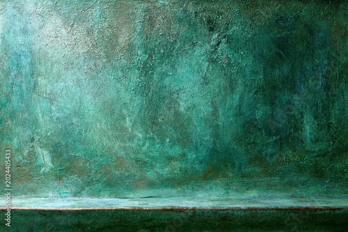 Textured green patina surface with a subtle horizontal shelf, abstract background for design
