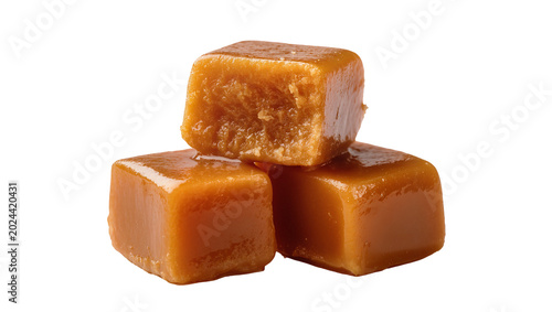 Cuadro en lienzo Three chewy caramel candies stacked, isolated on transparent background