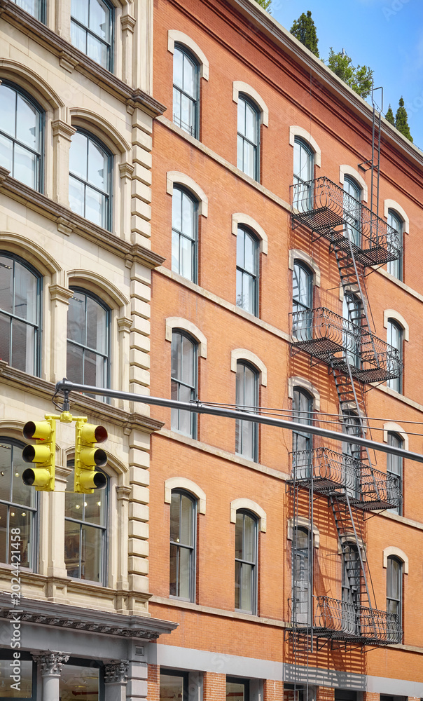 Fototapeta premium Old building with iron fire escape, New York City, USA.