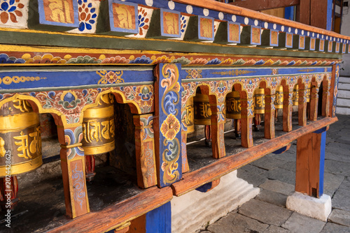 Paro Bhutan, close-up of niche of prayer wheels that encircle the Kyichu Lhakhang