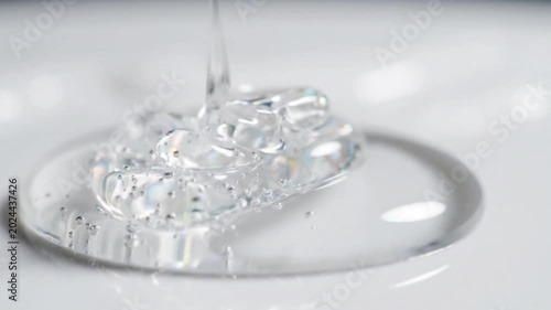 Clear gel liquid substance poured onto a white surface