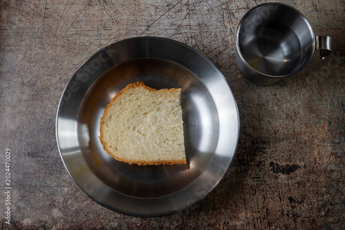 Fotografie Bread And Water Poverty Meal Concept
