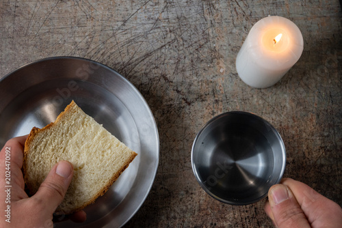 Schilderij op canvas Bread Water And Candle Crisis Concept