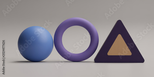 Three 3d geometric shapes including a blue sphere, purple ring, and dark triangle on gray