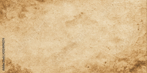 Foto An antique vintage parchment paper background with a stained and grungy brown te