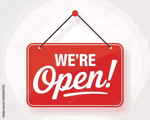 Red hanging sign with white text saying were open now