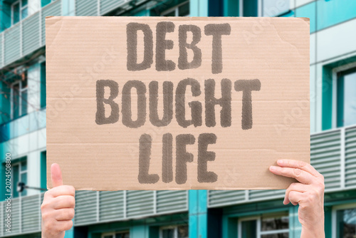 Fotografija "Debt Bought Life" Borrowed money funds daily life while generating permanent financial obligations