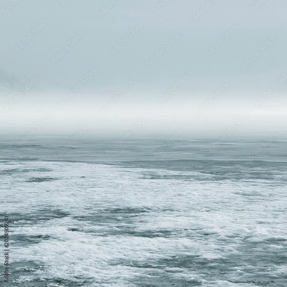 Fototapeta premium Mystical Ocean Seascape: Stormy Waves & Foggy Coastline in Moody Atmosphere
