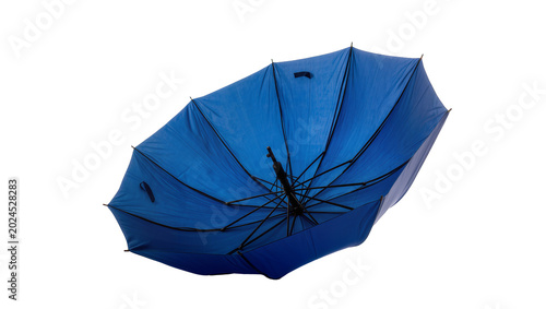 Photos Isolated vibrant blue umbrella turned inside out, displaying its intricate internal frame structure