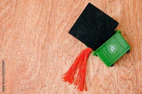 Photos Unemployment after graduation concept with a miniature academic mortarboard in a
