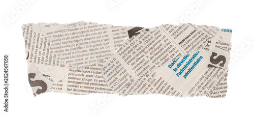 Bild auf Leinwand Torn newspaper clipping with French text