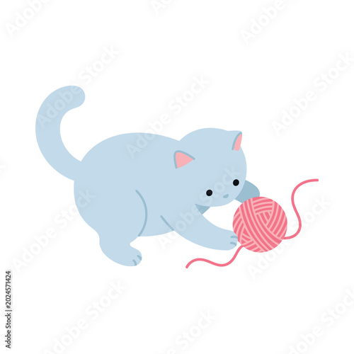 A cute blue cat plays with a pink ball of yarn indoors.