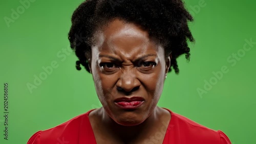 Woman Expressing Anger and Frustration on Green Screen Background 1.