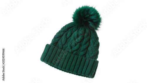Obraz na płótnie Isolated dark green knitted winter hat with a fluffy pompom, cozy beanie fashion