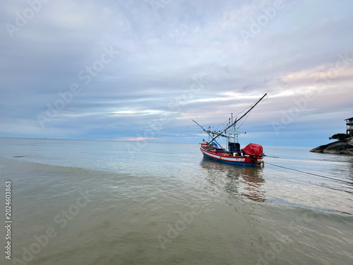 Valokuva Boats on the Ocean at Sunrise