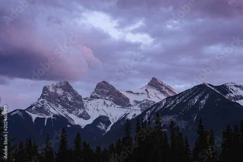 Three Sisters Under Evening Storm Clouds
