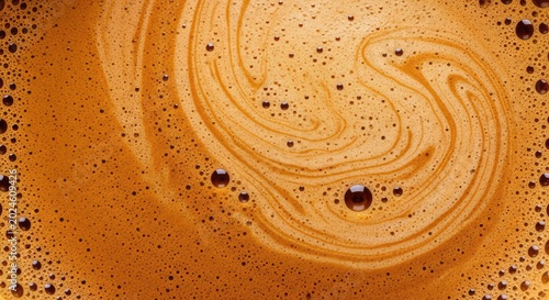 Detailed close-up of thick coffee foam texture with velvety bubbles and golden brown crema patterns, creating a warm and inviting beverage look, wallpaper, foam, cup