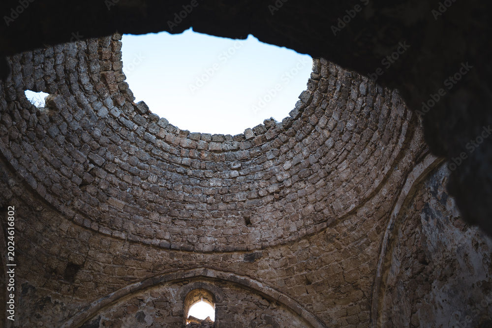 Fototapeta premium Ancient stone mosque interior ceiling view from below in Akrokorint, Greece