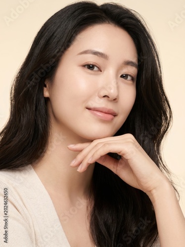 Beautiful young asian woman with glowing skin portrait