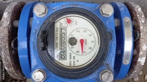 Close Up Of An Industrial Bulk Water Meter Dial Operating And Measuring Water Flow In A Horizontal Position
